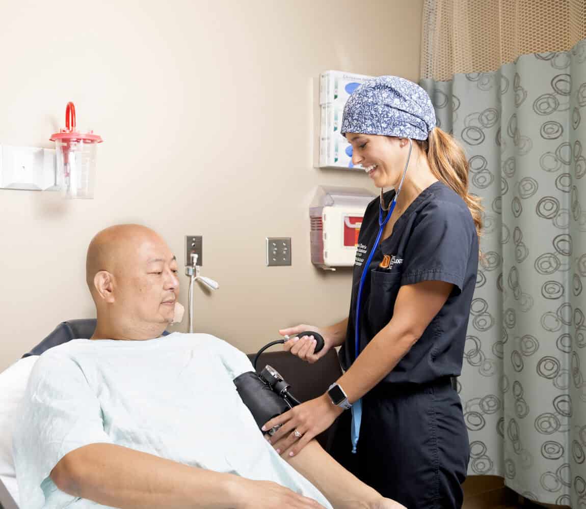 Certified nurse practioner takes a patient's blood pressure