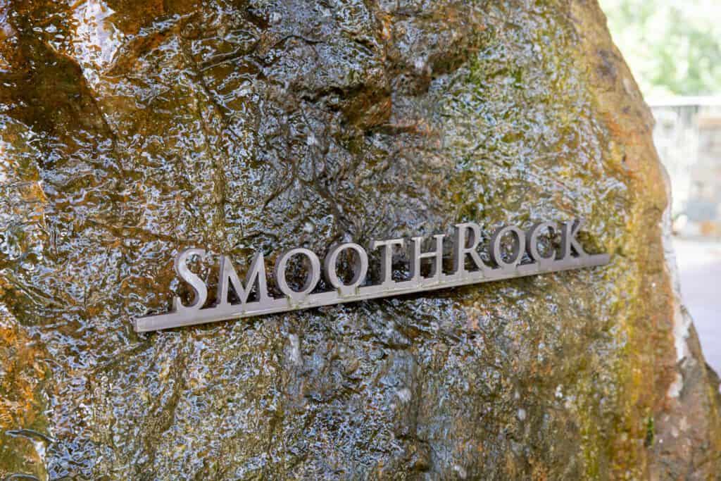 Closeup of SmoothRock name on rock with flowing water