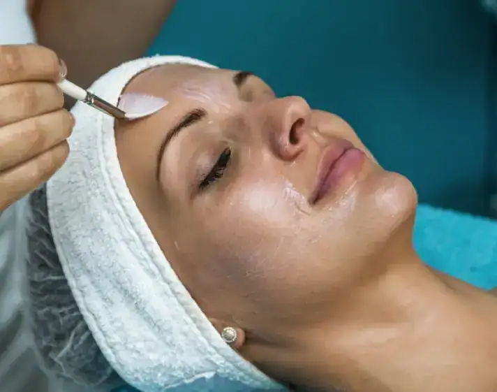 Woman getting cosmetic dermatology treatment